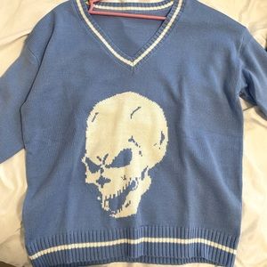 Skull V-neck sweater.